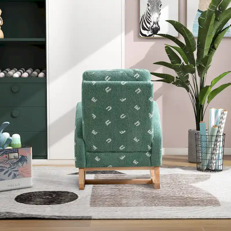 Groene, met bouclé gestoffeerde schommelstoel met hoge rugleuning en zijvak