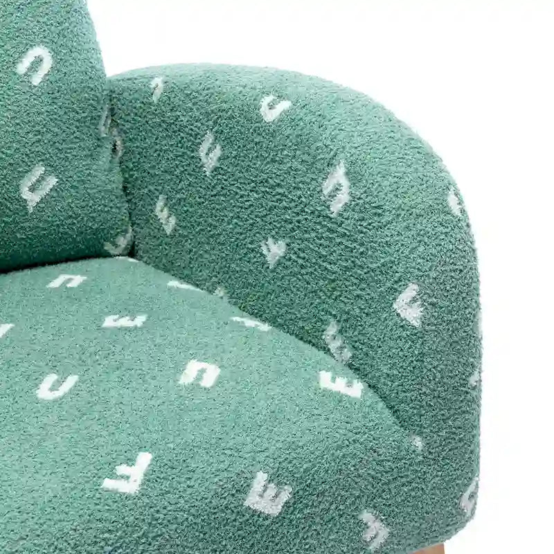 Groene, met bouclé gestoffeerde schommelstoel met hoge rugleuning en zijvak